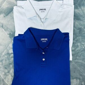 Two polo type long sleeve shirts size small light and dark blue
Excellent